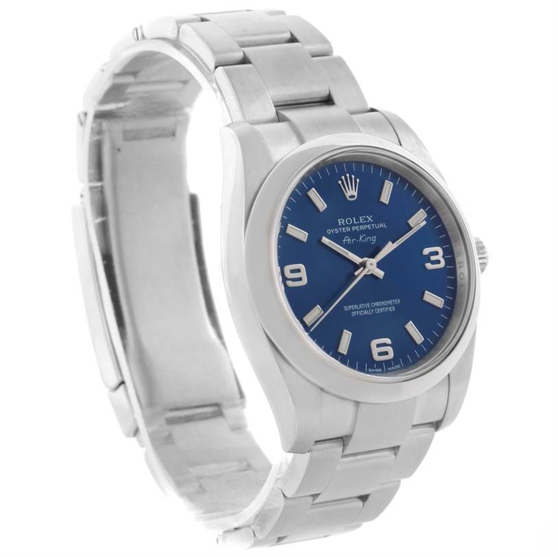The Rolex Air-King 114200 Men's Stainless Steel Blue Dial 114200 Men's Stainless Steel Blue Dial watch is shown at a left-side angle featuring its bracelet, casing, and blue dial.