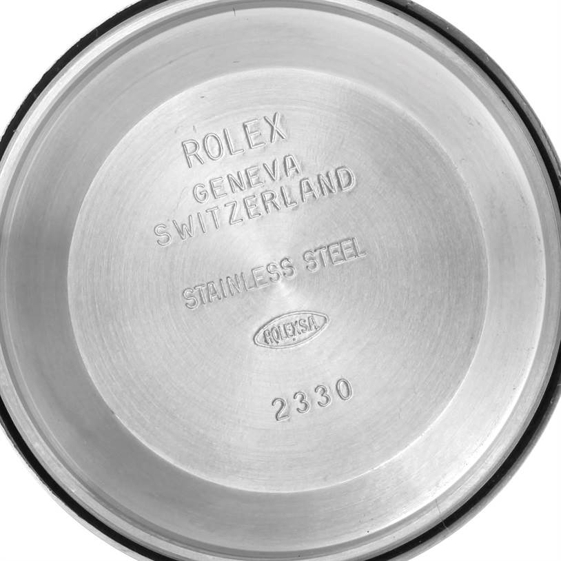 This image shows the inside case back of a Rolex Air-King 114200 Men's Stainless Steel Blue Dial 114200 Men's Stainless Steel Blue Dial watch, labeled with model details and material information.