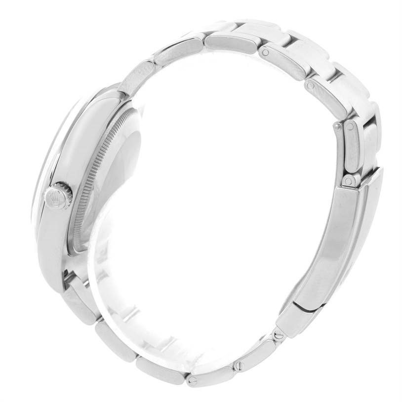 The image shows a side view of the Rolex Air-King 114200 Men's Stainless Steel Blue Dial 114200 Men's Stainless Steel Blue Dial watch, highlighting the crown and bracelet.