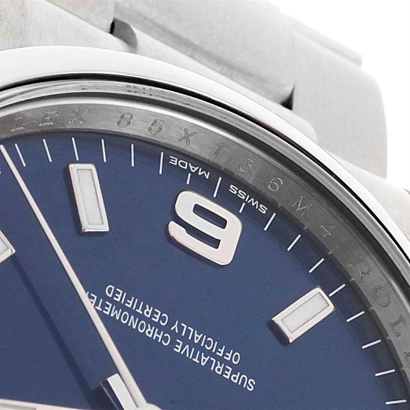 This close-up angle of a Rolex Air-King 114200 Men's Stainless Steel Blue Dial 114200 Men's Stainless Steel Blue Dial watch shows the dial, part of the bezel, and some hour markers.