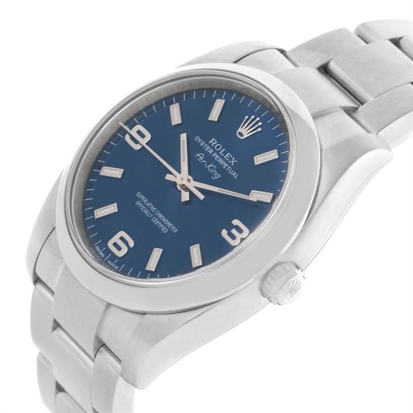 The image shows a Rolex Air-King 114200 Men's Stainless Steel Blue Dial 114200 Men's Stainless Steel Blue Dial watch with a blue dial, silver indices, and stainless steel bracelet from a side angle.