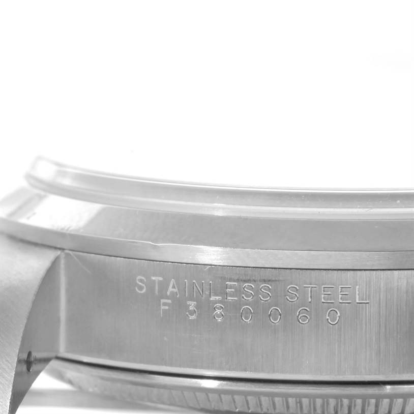 This image shows a close-up side view of the casing and serial number of a Rolex Air-King 14000 Men's Stainless Steel White Dial 14000 Men's Stainless Steel White Dial watch.