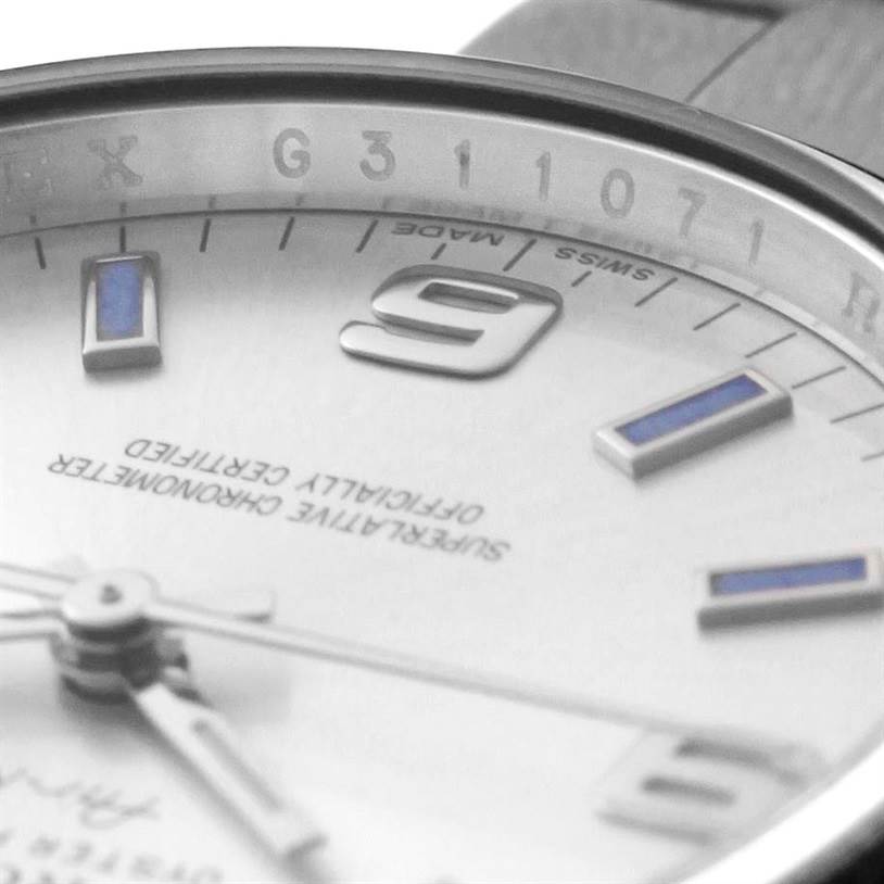 The image shows a close-up of the dial and bezel of a Rolex Air-King 114200 Men's Stainless Steel Silver Dial 114200 Men's Stainless Steel Silver Dial watch, highlighting the numerals and markers.