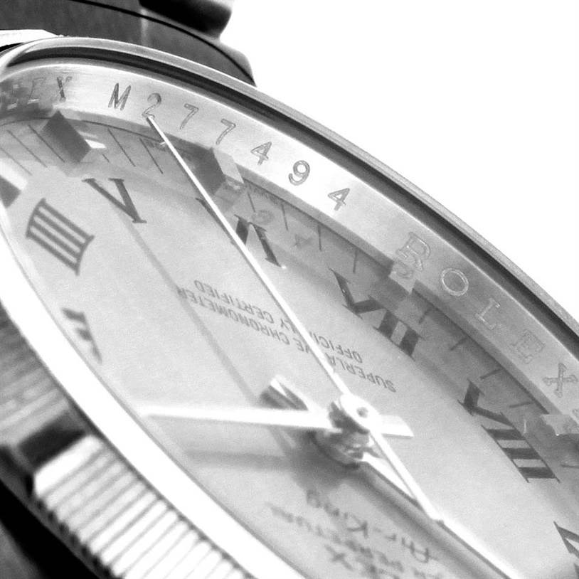 This close-up angle shows the dial, Roman numerals, and part of the bezel of the Rolex Air-King 114210 Men's Stainless Steel Silver Dial 114210 Men's Stainless Steel Silver Dial watch.
