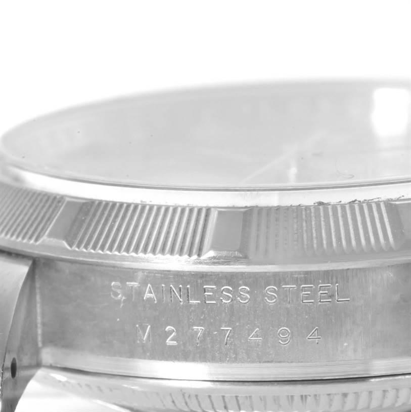 This close-up image shows the stainless steel casing and partially visible bezel of a Rolex Air-King 114210 Men's Stainless Steel Silver Dial 114210 Men's Stainless Steel Silver Dial watch.