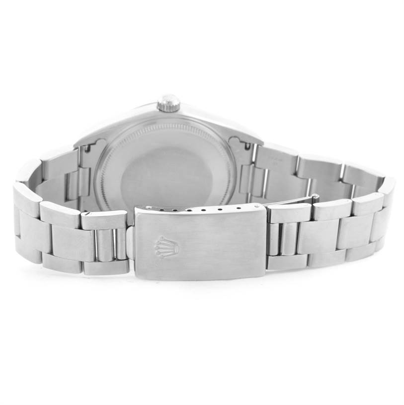 The image shows the back view of a Rolex Air-King 14000 Men's Stainless Steel Pink Dial 14000 Men's Stainless Steel Pink Dial watch, highlighting its stainless steel bracelet and clasp.