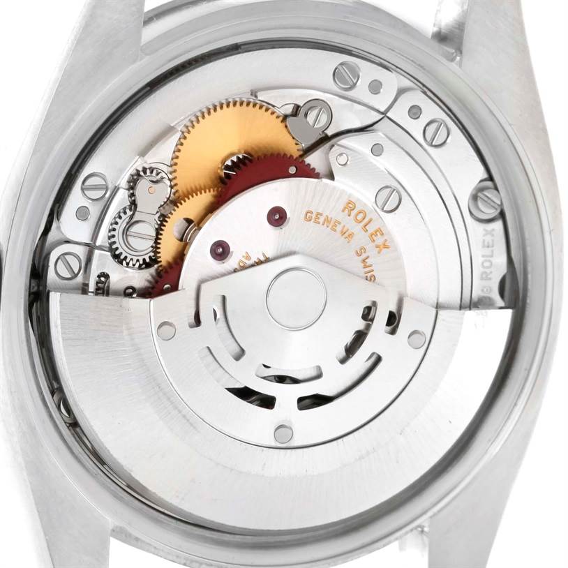 The image shows the internal mechanisms of an Air-King model by Rolex from a back angle, featuring gears and components.