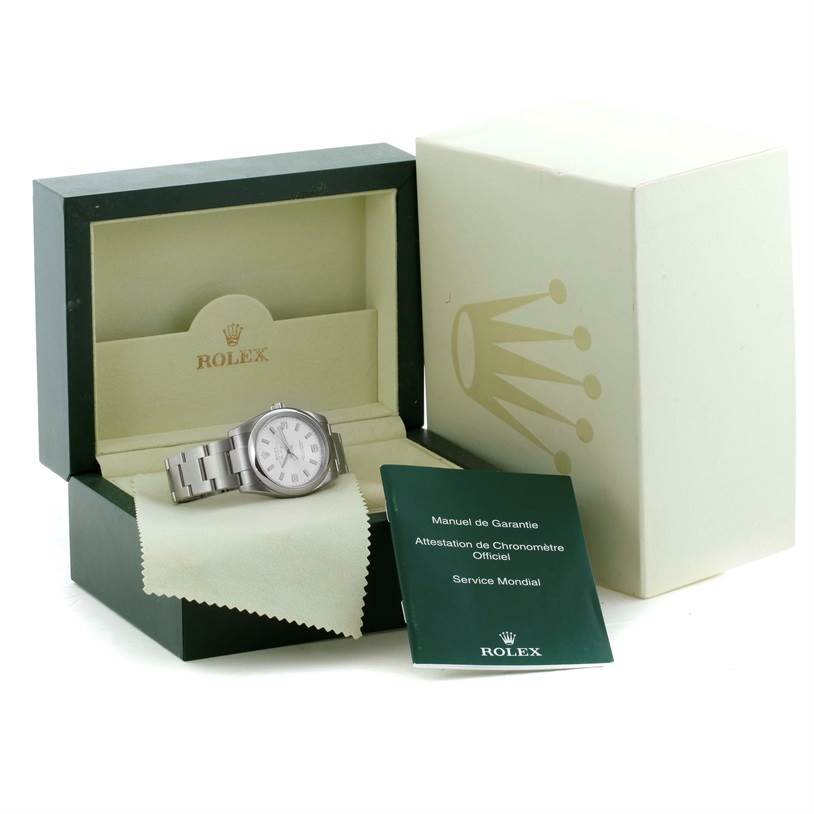 The image shows a Rolex Air-King 114200SASO Men's Stainless Steel Silver Dial 114200SASO Men's Stainless Steel Silver Dial watch placed inside its open box, alongside a booklet and warranty card.
