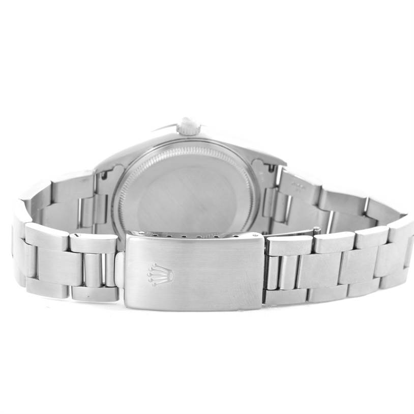 This image shows the back and clasp of the Rolex Air-King 14000 Men's Stainless Steel Blue Dial 14000 Men's Stainless Steel Blue Dial watch at an angle revealing the case back and bracelet.