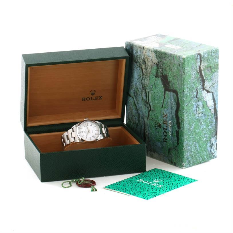 The image shows a Rolex Air-King 14000 Men's Stainless Steel White Dial 14000 Men's Stainless Steel White Dial watch inside an open green box, accompanied by its outer box and a green booklet.