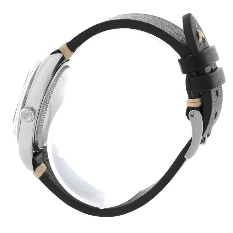 This side view of the Rolex Air-King 14000 Men's Stainless Steel Black Dial 14000 Men's Stainless Steel Black Dial watch shows the case, crown, and leather strap.