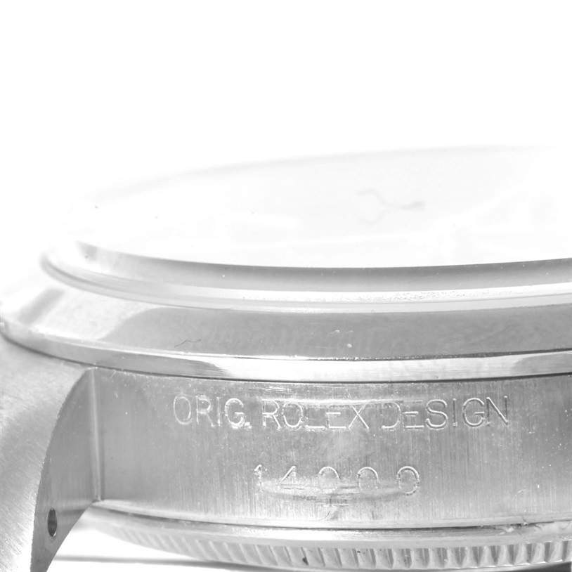 This image shows a close-up side view of the case and bezel of a Rolex Air-King 14000 Men's Stainless Steel Black Dial 14000 Men's Stainless Steel Black Dial watch, highlighting the engraved text.