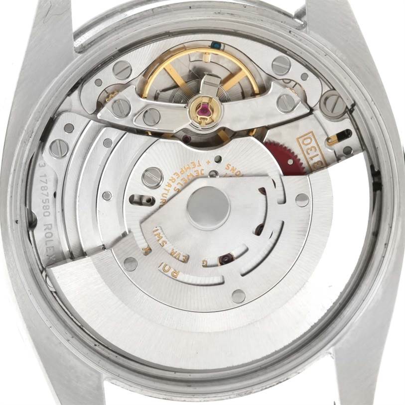 This is a close-up view of the movement from the back of a Rolex Air-King 114210 Men's Stainless Steel Silver Dial 114210 Men's Stainless Steel Silver Dial watch, revealing its intricate internal components.