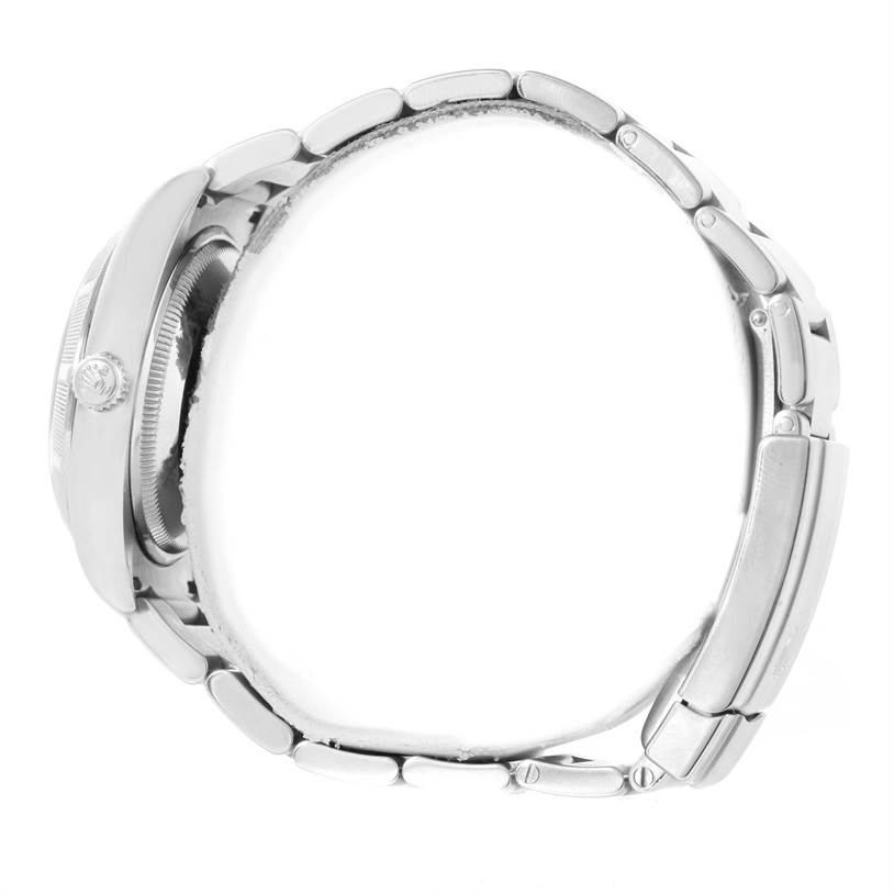 This side view of the Rolex Air-King 114210 Men's Stainless Steel Silver Dial 114210 Men's Stainless Steel Silver Dial watch shows its metal bracelet, case, and crown.