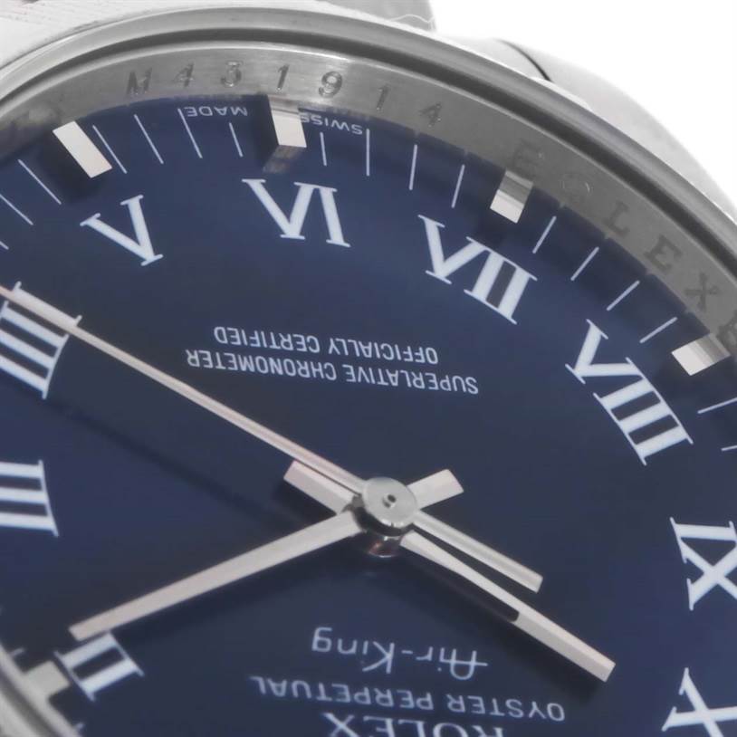 This close-up of the Rolex Air-King 114200BLRO Men's Stainless Steel Blue Dial 114200BLRO Men's Stainless Steel Blue Dial watch showcases the dial, hands, and part of the outer bezel.