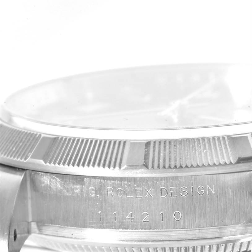 Close-up side view of the Rolex Air-King 114200BLRO Men's Stainless Steel Blue Dial 114200BLRO Men's Stainless Steel Blue Dial watch case, showing the design engraving and bezel.