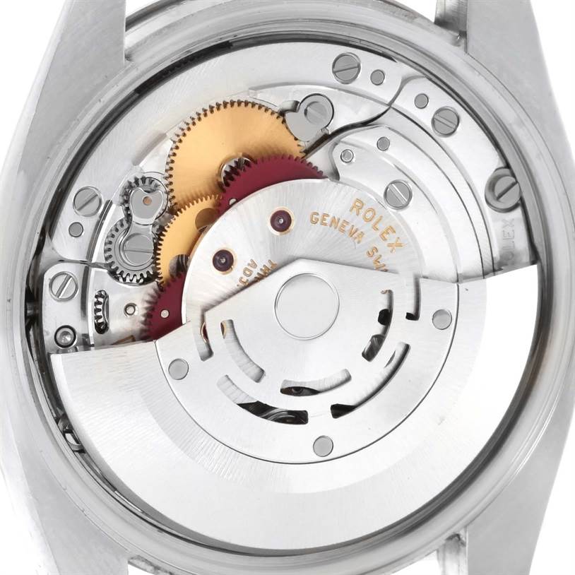This image shows an internal view of the Rolex Air-King 114234SAPSO Men's Stainless Steel Silver Dial 114234SAPSO Men's Stainless Steel Silver Dial watch, showcasing its intricate mechanical movement parts.