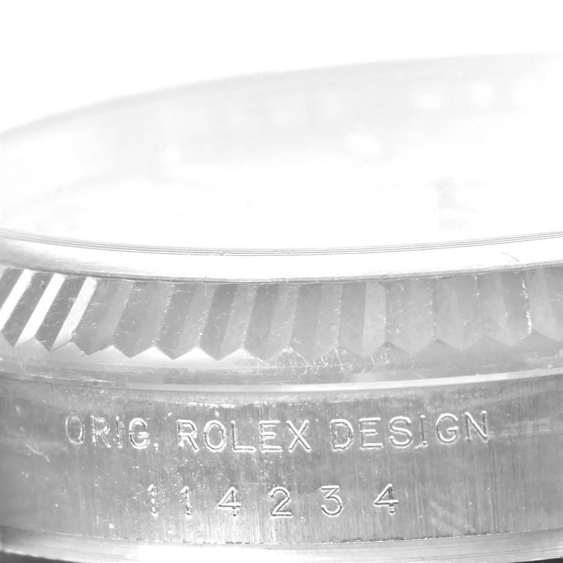 This image shows a close-up of the case side of a Rolex Air-King 114234SAPSO Men's Stainless Steel Silver Dial 114234SAPSO Men's Stainless Steel Silver Dial watch, featuring the engraved model number.