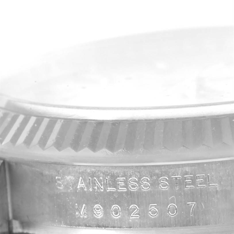 The image shows a close-up view of the side of the Rolex Air-King 114234SAPSO Men's Stainless Steel Silver Dial 114234SAPSO Men's Stainless Steel Silver Dial watch, highlighting the stainless steel bezel and part of the serial number.