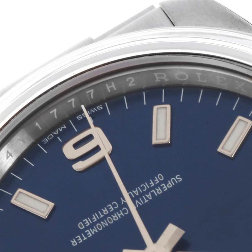 This image shows a close-up of the dial and part of the bezel of a Rolex Air-King 114200BLASO Men's Stainless Steel Blue Dial 114200BLASO Men's Stainless Steel Blue Dial watch with a blue face and numeral indicators.