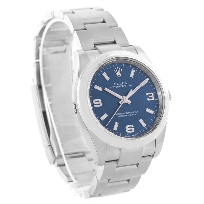 The image shows a Rolex Air-King 114200BLASO Men's Stainless Steel Blue Dial 114200BLASO Men's Stainless Steel Blue Dial watch at a three-quarter angle, highlighting its face, dial, bezel, and metal bracelet.