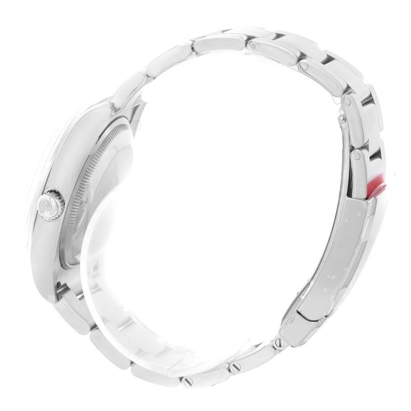 The image shows a side view of a Rolex Air-King 114200BLASO Men's Stainless Steel Blue Dial 114200BLASO Men's Stainless Steel Blue Dial watch, highlighting the bracelet and crown.