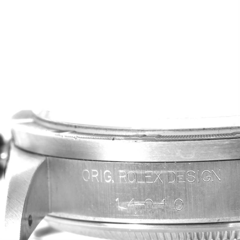 The image shows a close-up side view of the Air-King model by Rolex, focusing on the case with engraved text.