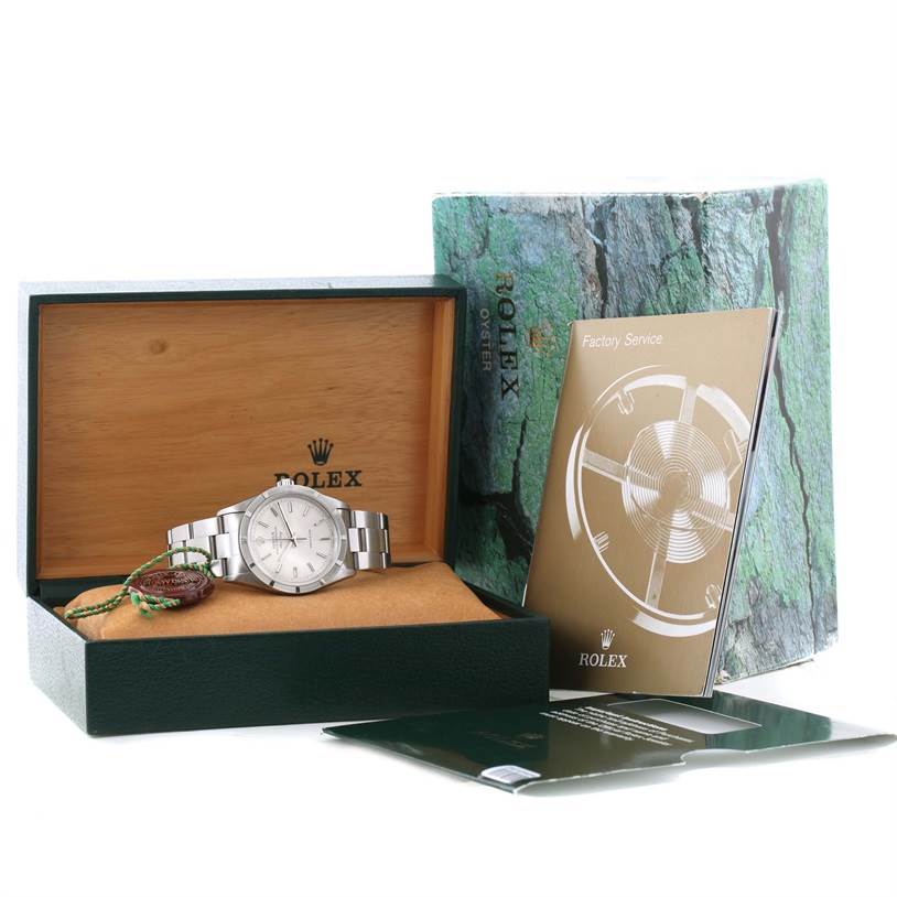 The image shows a Rolex Air-King 14010 Men's Stainless Steel Silver Dial 14010 Men's Stainless Steel Silver Dial watch inside its open box, along with accompanying booklets and packaging.