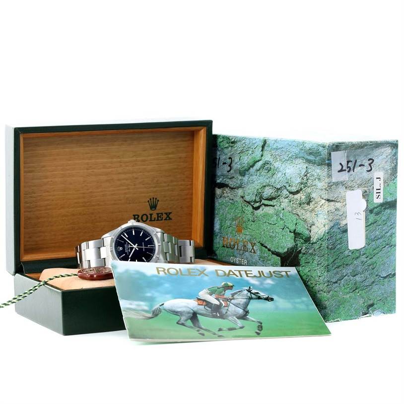 The image shows a Rolex Air-King 14010 Men's Stainless Steel Black Dial 14010 Men's Stainless Steel Black Dial watch with its box, manual, and additional packaging.