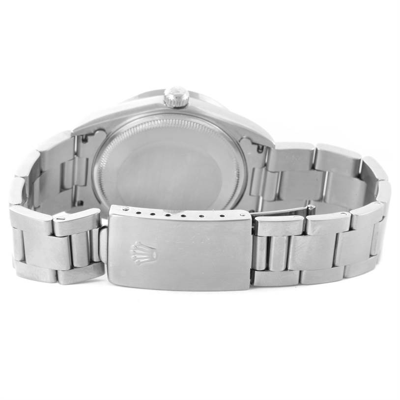 The image shows the back case and closed clasp of a Rolex Air-King 14010 Men's Stainless Steel Black Dial 14010 Men's Stainless Steel Black Dial watch from a rear angle.