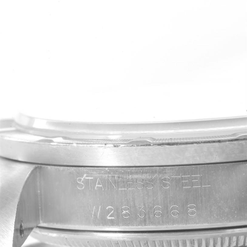 The image shows a close-up side view of the Rolex Air-King 14010 Men's Stainless Steel Silver Dial 14010 Men's Stainless Steel Silver Dial watch, focusing on the case with the "STAINLESS STEEL" engraving.