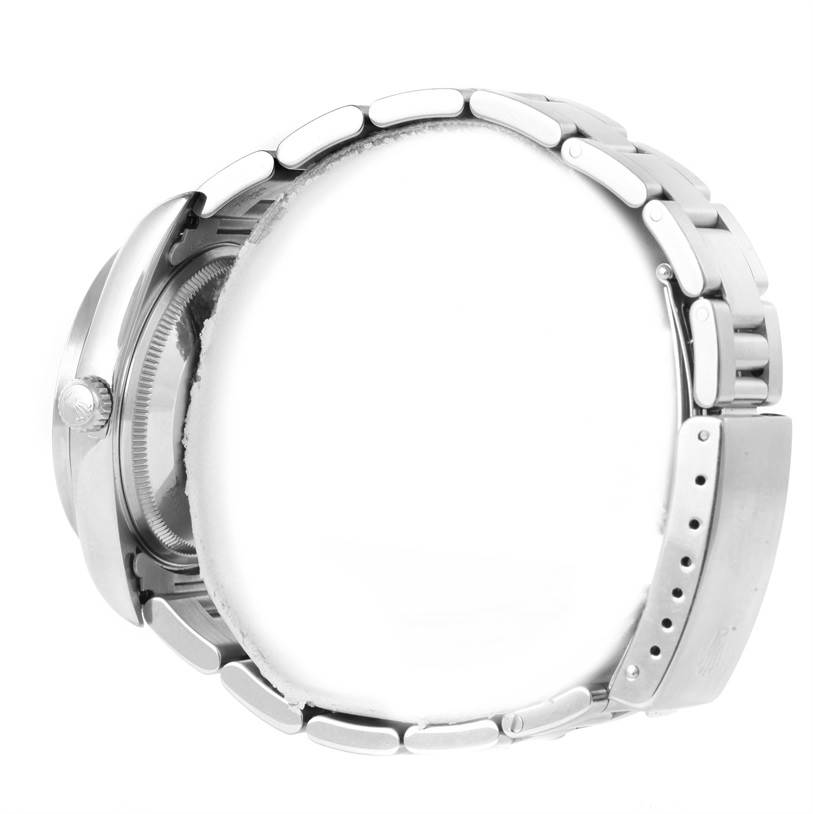 This side view image of the Rolex Air-King 14010 Men's Stainless Steel Silver Dial 14010 Men's Stainless Steel Silver Dial watch shows the case, crown, and stainless steel bracelet with clasp.