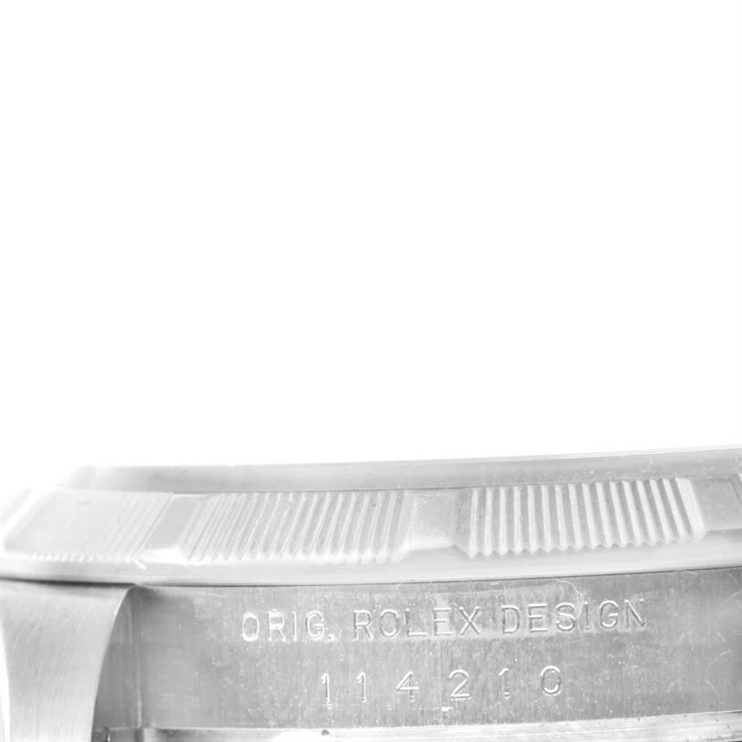 This image shows a close-up angled view of the case side and serial number of a Rolex Air-King 114210 Men's Stainless Steel White Dial 114210 Men's Stainless Steel White Dial watch.