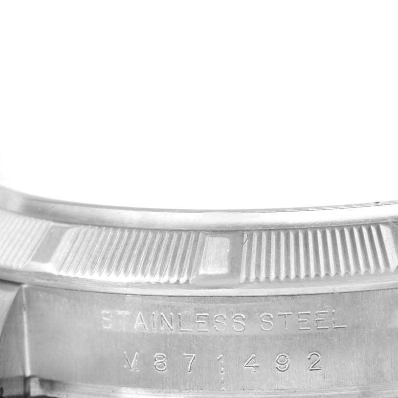 The image shows a close-up view of the stainless steel casing with the serial number of a Rolex Air-King 114210 Men's Stainless Steel White Dial 114210 Men's Stainless Steel White Dial watch.