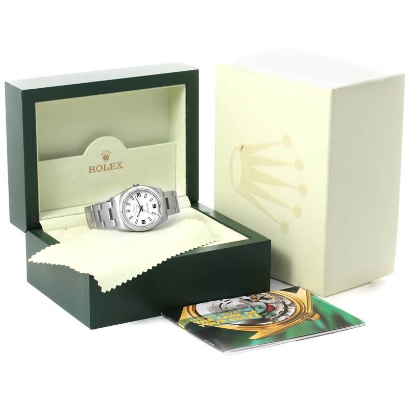 Displayed at an angle, the Rolex Air-King 114210 Men's Stainless Steel White Dial 114210 Men's Stainless Steel White Dial watch shows its face and band within its box, alongside the packaging and a booklet.