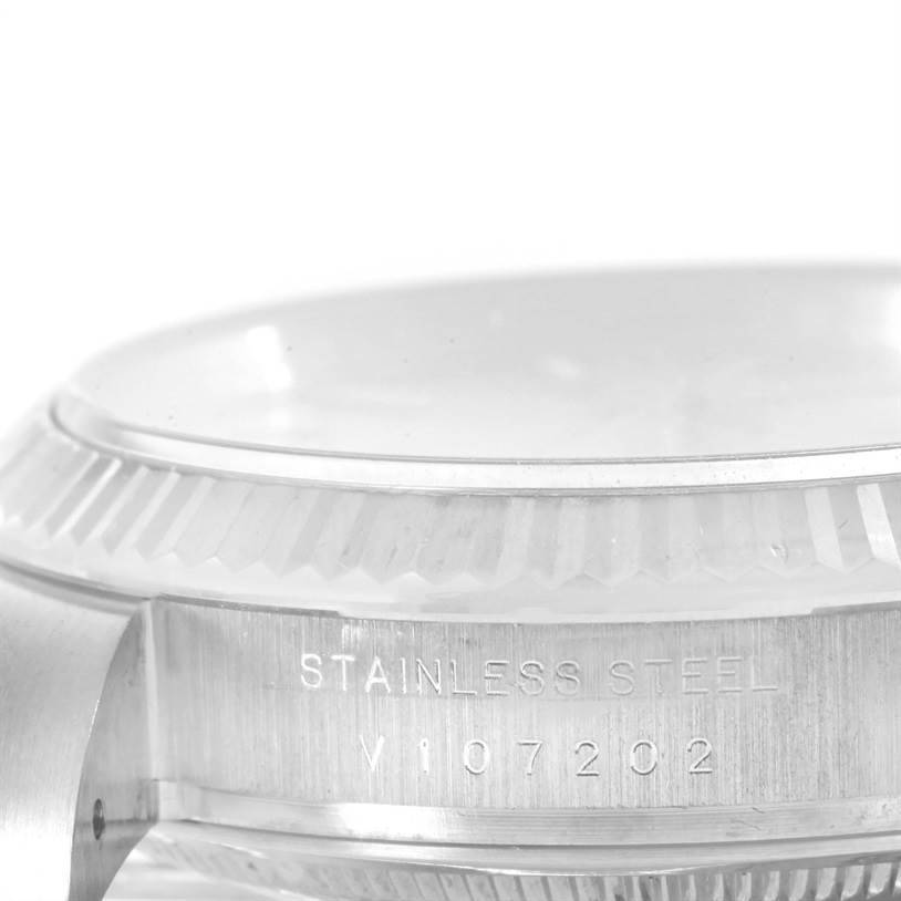 The image shows a close-up side view of the Rolex Air-King 114234 Men's Stainless Steel Silver Dial 114234 Men's Stainless Steel Silver Dial watch, highlighting the engraving and part of the crown.