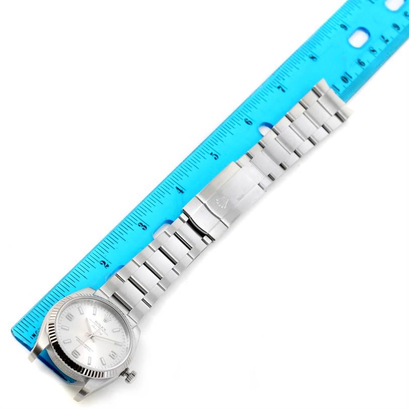 The Rolex Air-King 114234 Men's Stainless Steel Silver Dial 114234 Men's Stainless Steel Silver Dial watch is shown from an overhead angle, including the face, bezel, bracelet, and clasp.