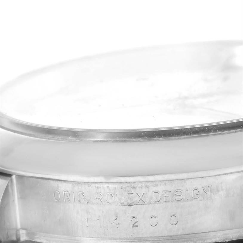 The image shows a close-up of the side of the case and bezel of a Rolex Air-King 114200 Men's Stainless Steel White Dial 114200 Men's Stainless Steel White Dial watch, showcasing the engraved model number.