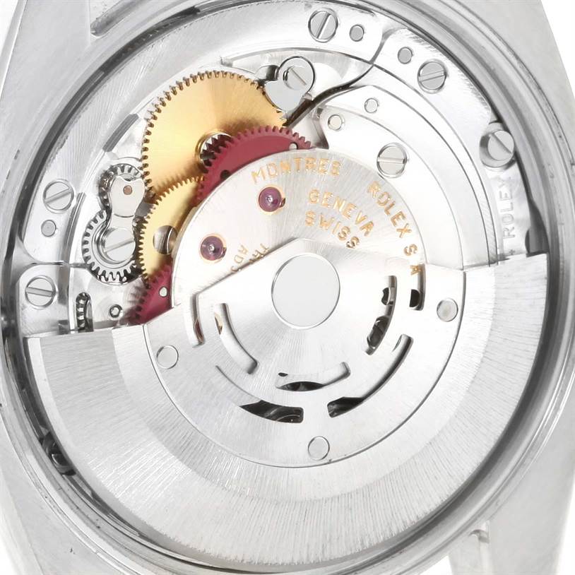 This image shows the internal mechanism of a Rolex Air-King 114200 Men's Stainless Steel White Dial 114200 Men's Stainless Steel White Dial watch, including gears and the rotor, from the back angle.