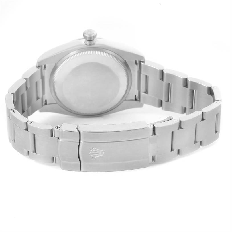 This image shows the back view of a Rolex Air-King 114200BLASO Men's Stainless Steel Blue Dial 114200BLASO Men's Stainless Steel Blue Dial watch, highlighting the case back and the bracelet clasp.