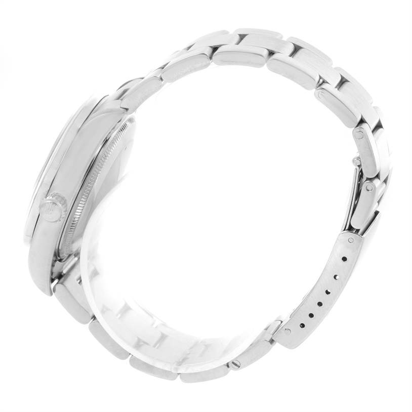 This image shows a side view of the Rolex Air-King 14010 Men's Stainless Steel White Dial 14010 Men's Stainless Steel White Dial watch, focusing on the bracelet, clasp, and crown.