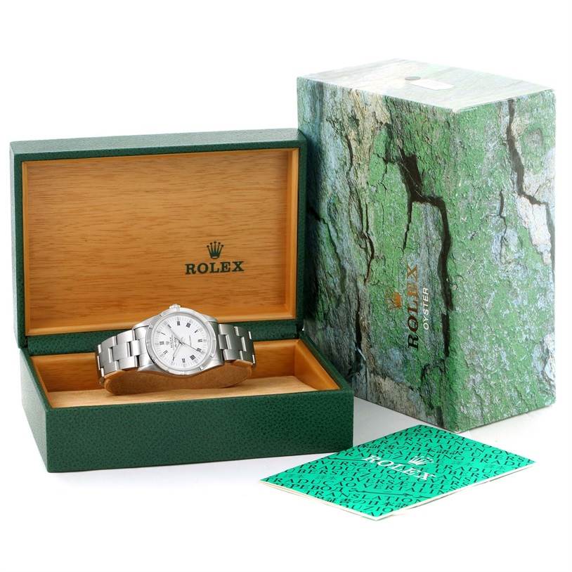 The image shows a Rolex Air-King 14010 Men's Stainless Steel White Dial 14010 Men's Stainless Steel White Dial watch in an open green box with the outer packaging and a booklet displayed beside it.