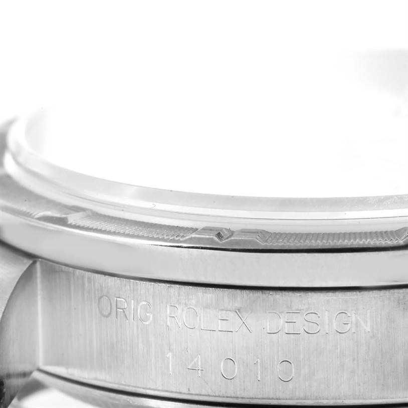 This close-up image shows the bezel and case of the Rolex Air-King 14010 Men's Stainless Steel White Dial 14010 Men's Stainless Steel White Dial watch, including engraved text and part of the crystal.