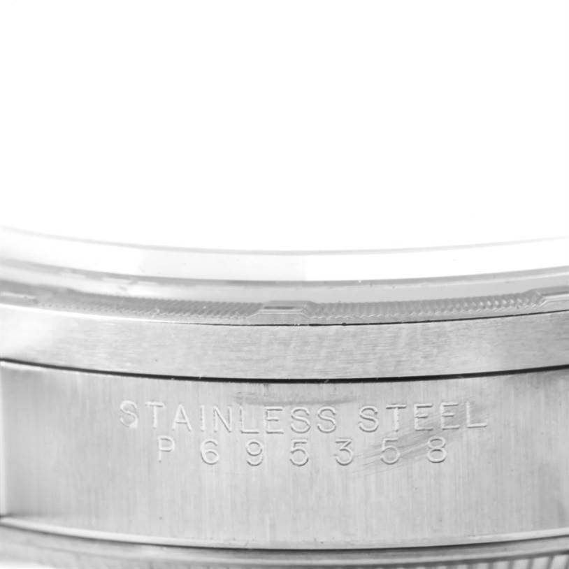 The image shows a close-up of the case side of the Rolex Air-King 14010 Men's Stainless Steel Blue Dial 14010 Men's Stainless Steel Blue Dial watch, highlighting the "STAINLESS STEEL" marking and part of the serial number.