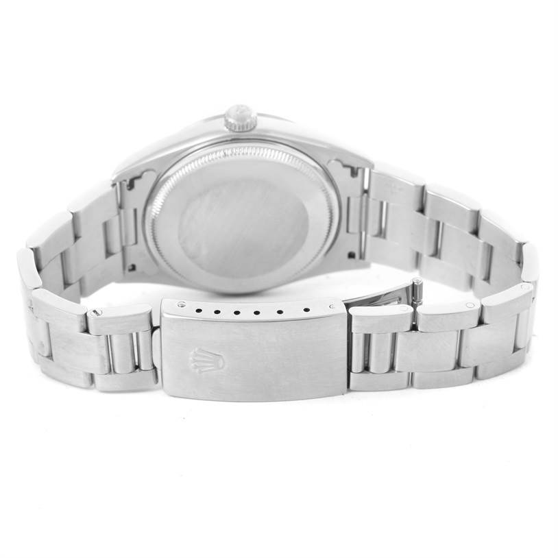 The image shows the back view of a Rolex Air-King 14000 Men's Stainless Steel Blue Dial 14000 Men's Stainless Steel Blue Dial watch, highlighting its case back and metal bracelet with a clasp.