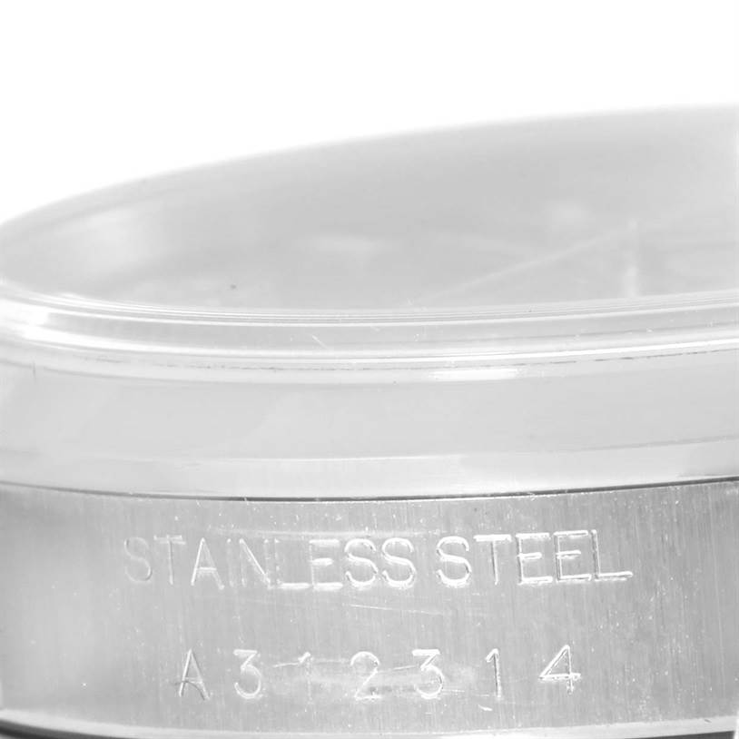 The image shows a close-up of the side of a Rolex Air-King 14000 Men's Stainless Steel Pink Dial 14000 Men's Stainless Steel Pink Dial watch, highlighting the "Stainless Steel" engraving and part of the model number.