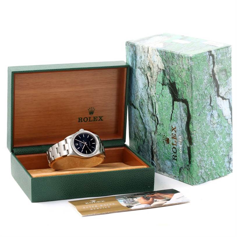 The image displays a Rolex Air-King 14010 Men's Stainless Steel Black Dial 14010 Men's Stainless Steel Black Dial watch in its open green box, alongside its outer box and documents.
