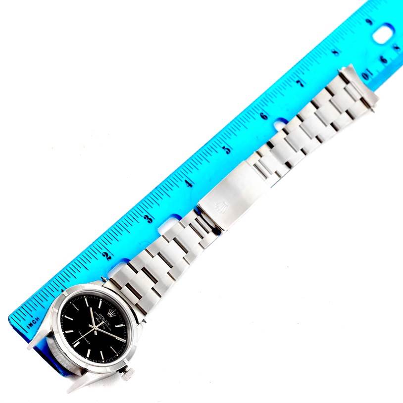 The image shows a Rolex Air-King 14010 Men's Stainless Steel Black Dial 14010 Men's Stainless Steel Black Dial watch laid flat with a blue ruler measuring its length.