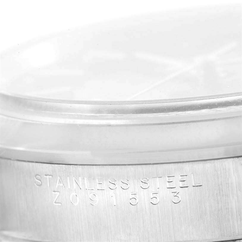 This image shows a close-up of the stainless steel casing with the serial number of the Rolex Air-King 14000 Men's Stainless Steel Black Dial 14000 Men's Stainless Steel Black Dial watch.