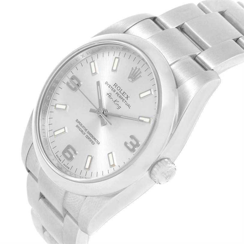 The Rolex Air-King 114200 Men's Stainless Steel Silver Dial 114200 Men's Stainless Steel Silver Dial watch is shown from a diagonal angle, highlighting the face, bezel, and part of the bracelet.